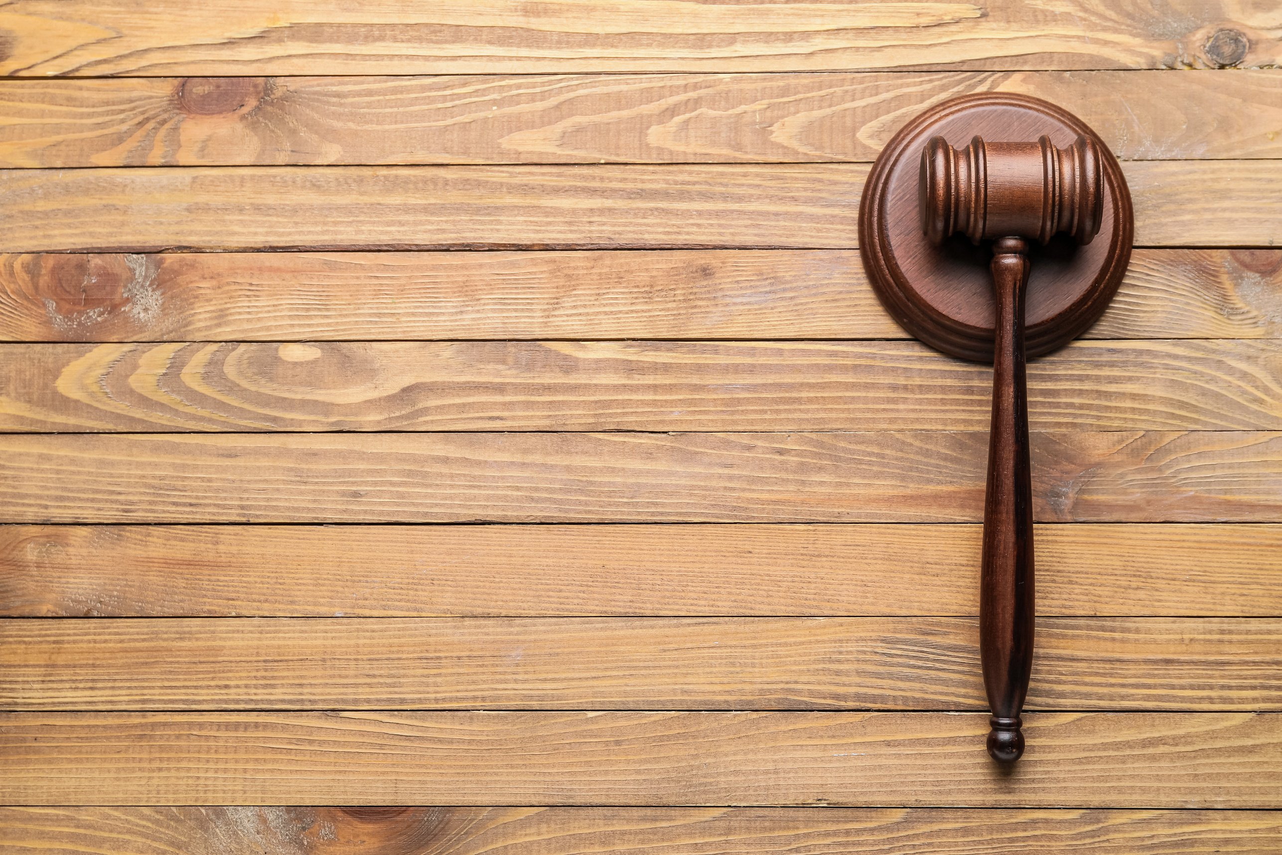 Judge's Gavel on Wooden Background